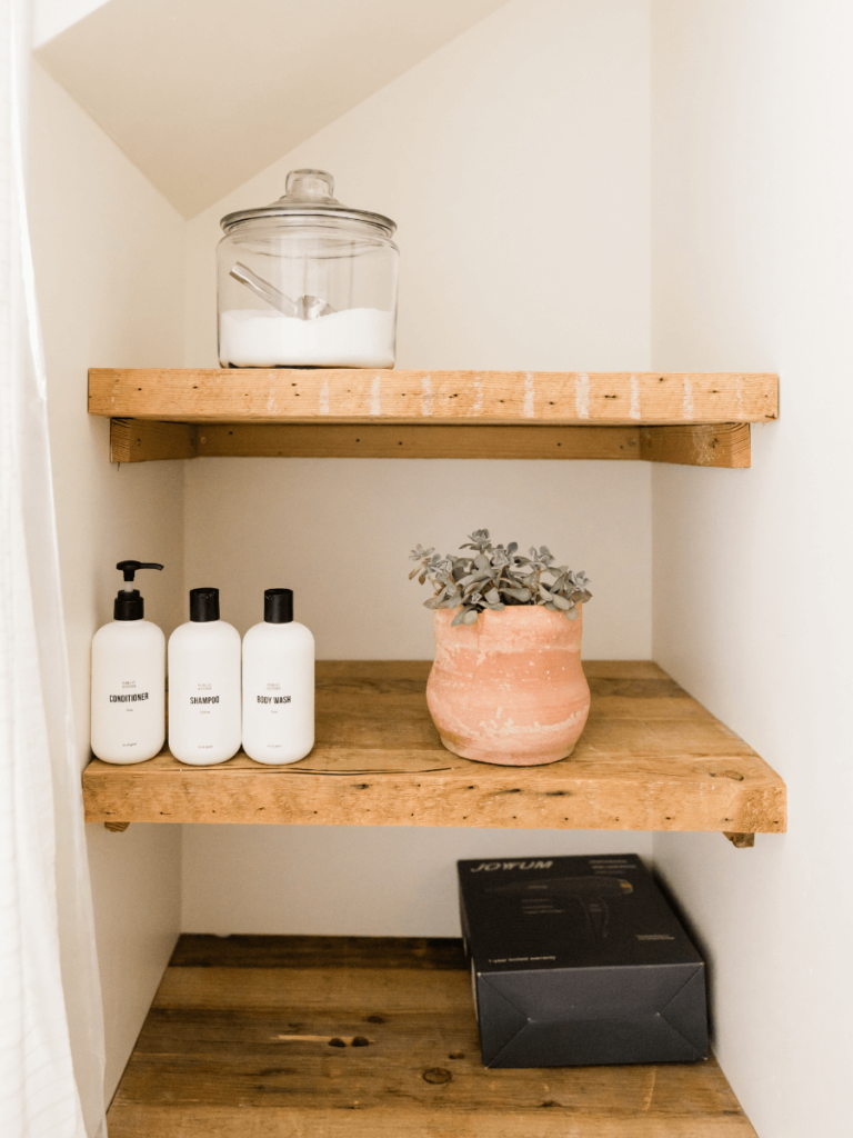 Some great small bathroom tips are to add custom shelves even in space spaces to make more space rather than specific cabinetry.